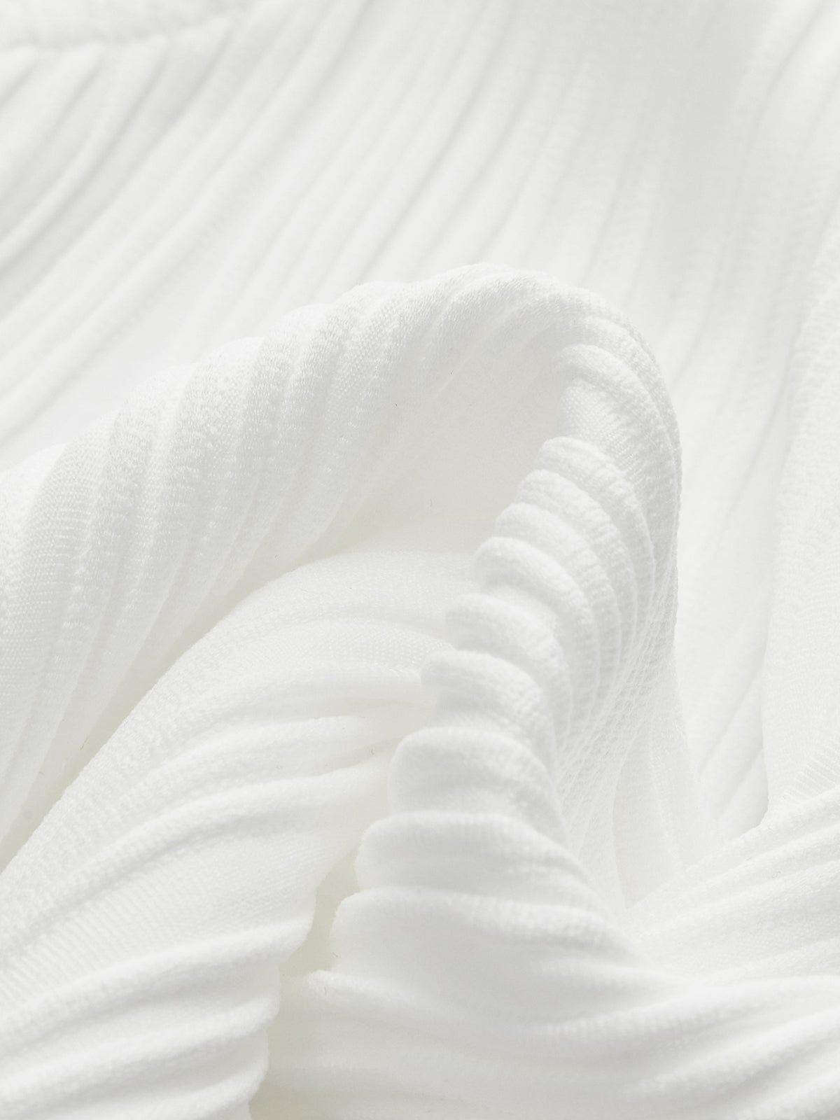 Close-up of white ribbed tank top neckline