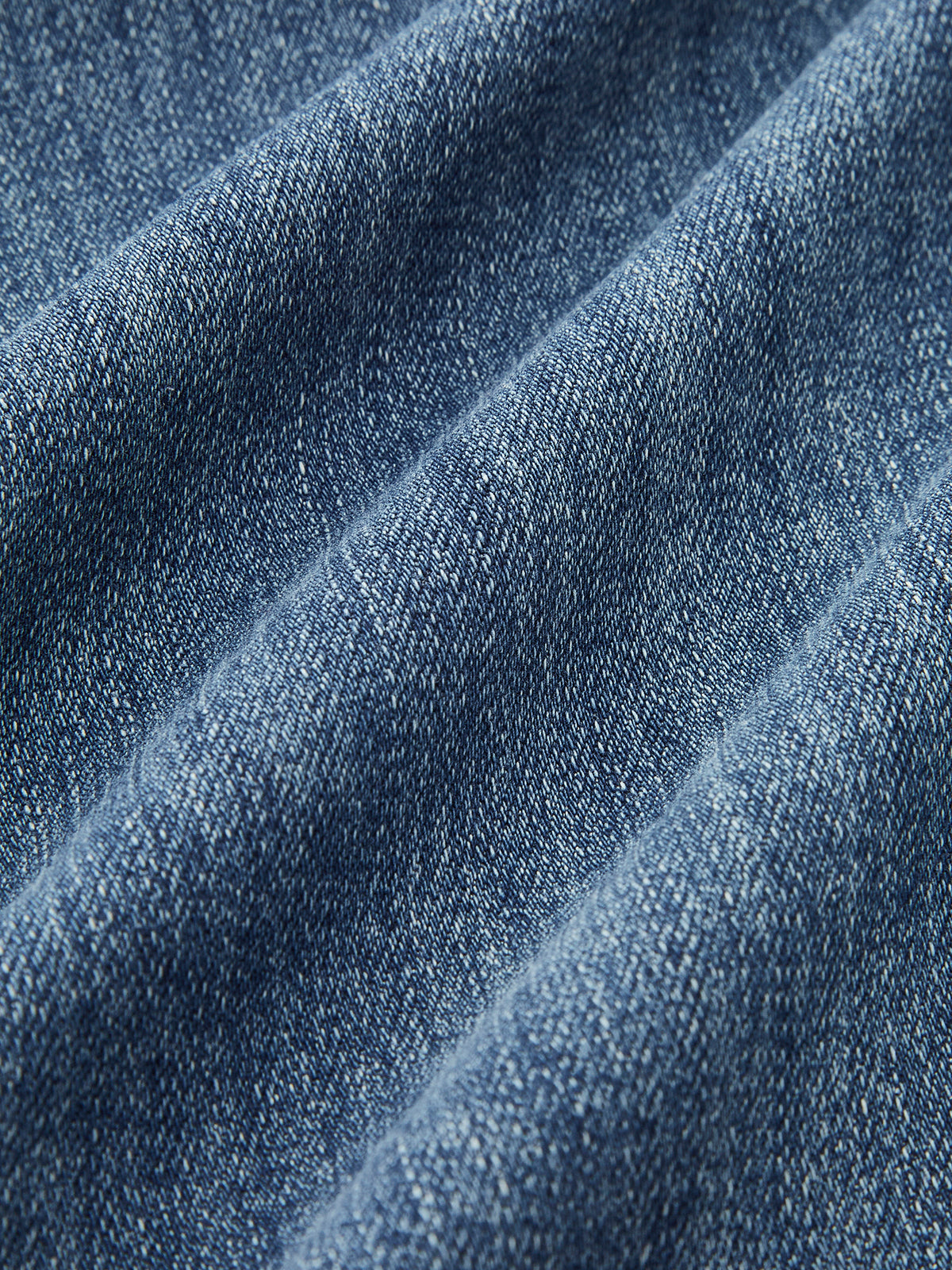Flared jeans light blue fabric texture close-up