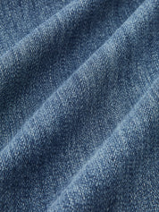 Flared jeans light blue fabric texture close-up