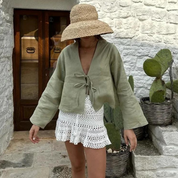 Light green blouse with tie detail outdoor front view