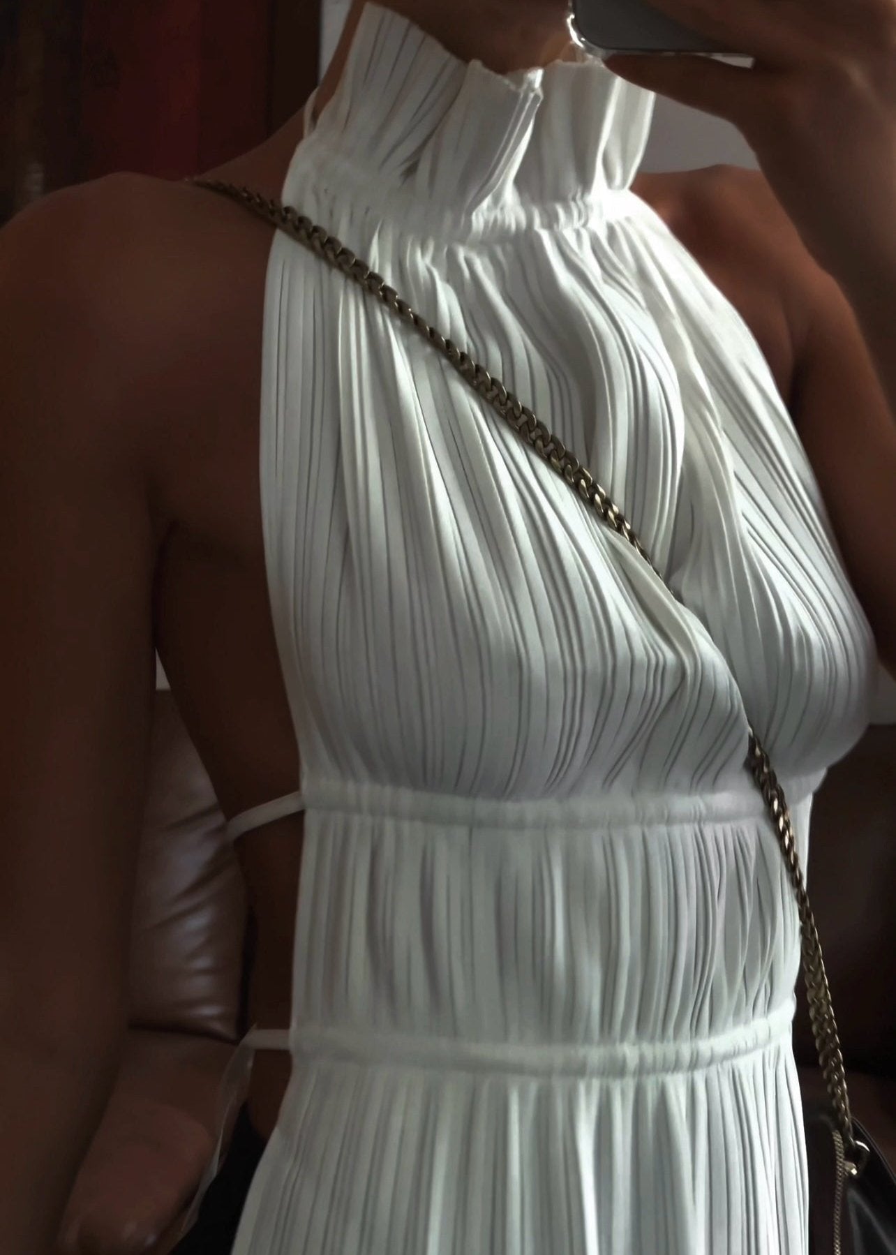 White plissé halter top with chain detail, close-up back view