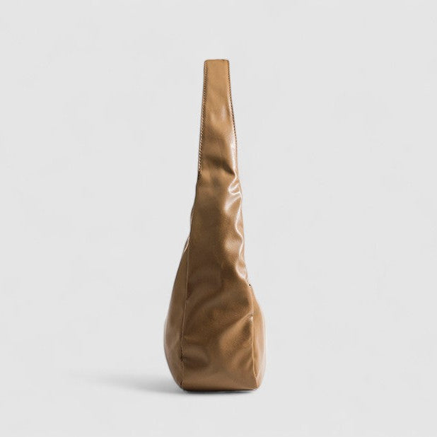 Tan leather slouchy shoulder bag side view