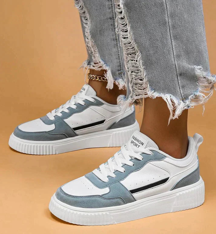 White and light blue sneakers with platform sole, front view