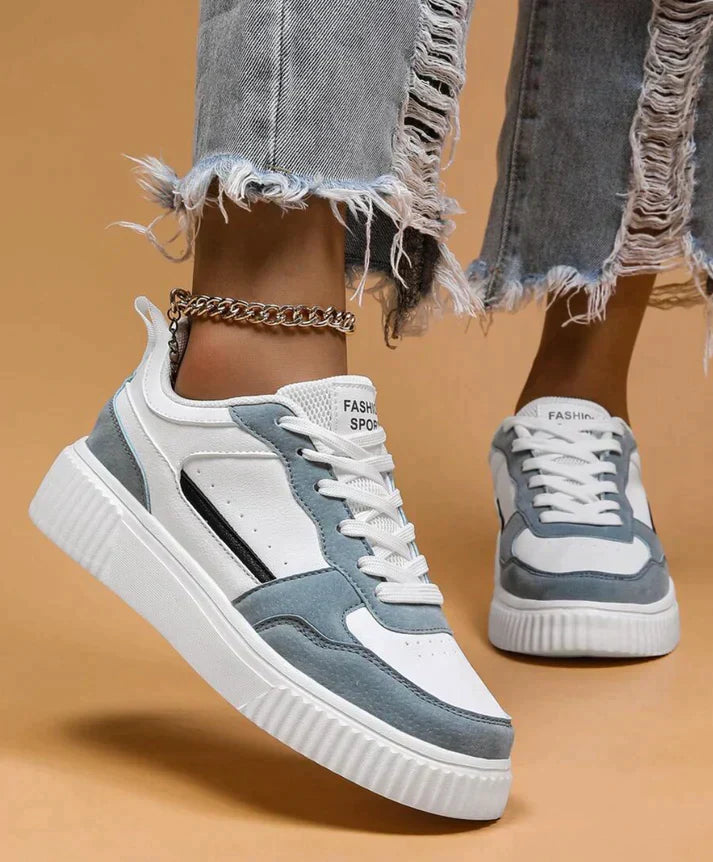 White and light blue sneakers with platform sole, close-up side view