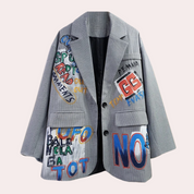 Gray checkered blazer with bold graphic patches front view