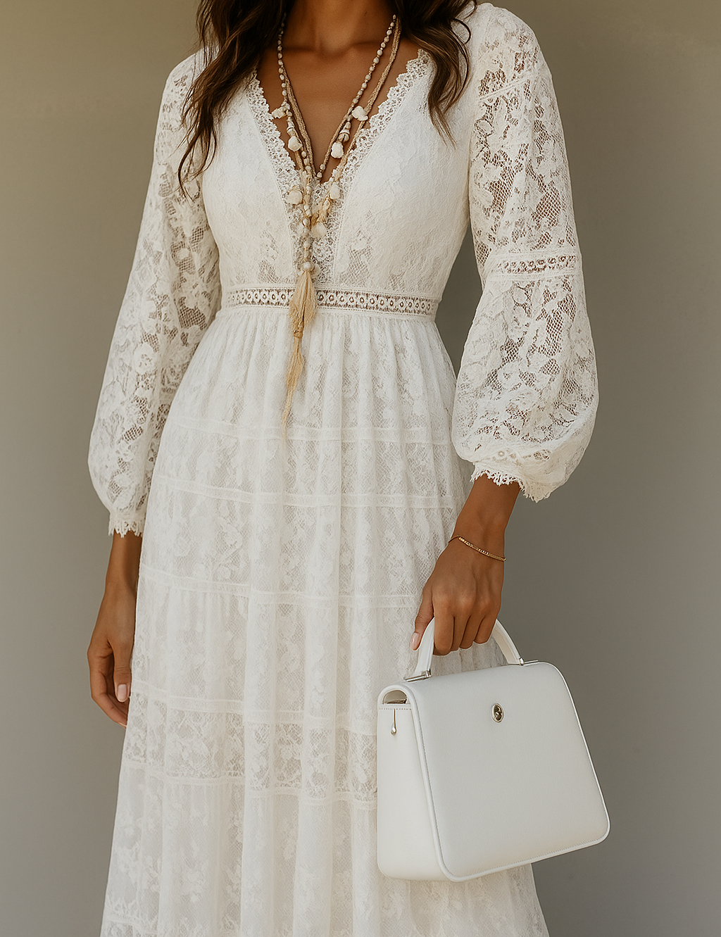White lace maxi dress with bell sleeves and white handbag, front view