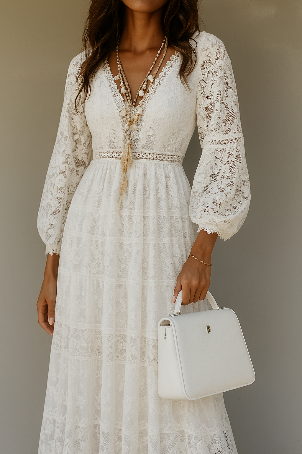 White lace maxi dress with bell sleeves and white handbag, front view