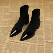 Black ankle boots with pointed toe and block heel front view