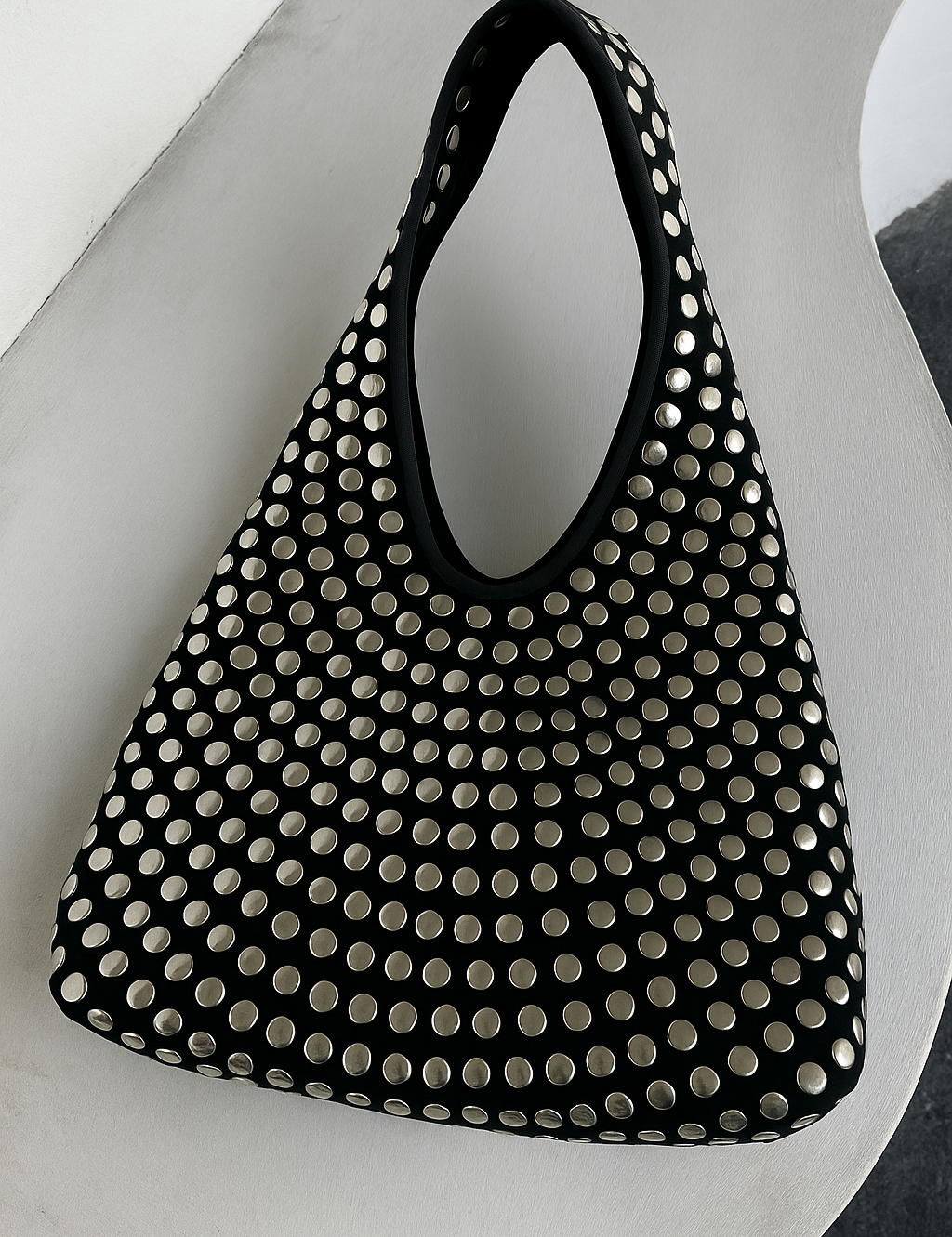 Black hobo bag with silver studs front view