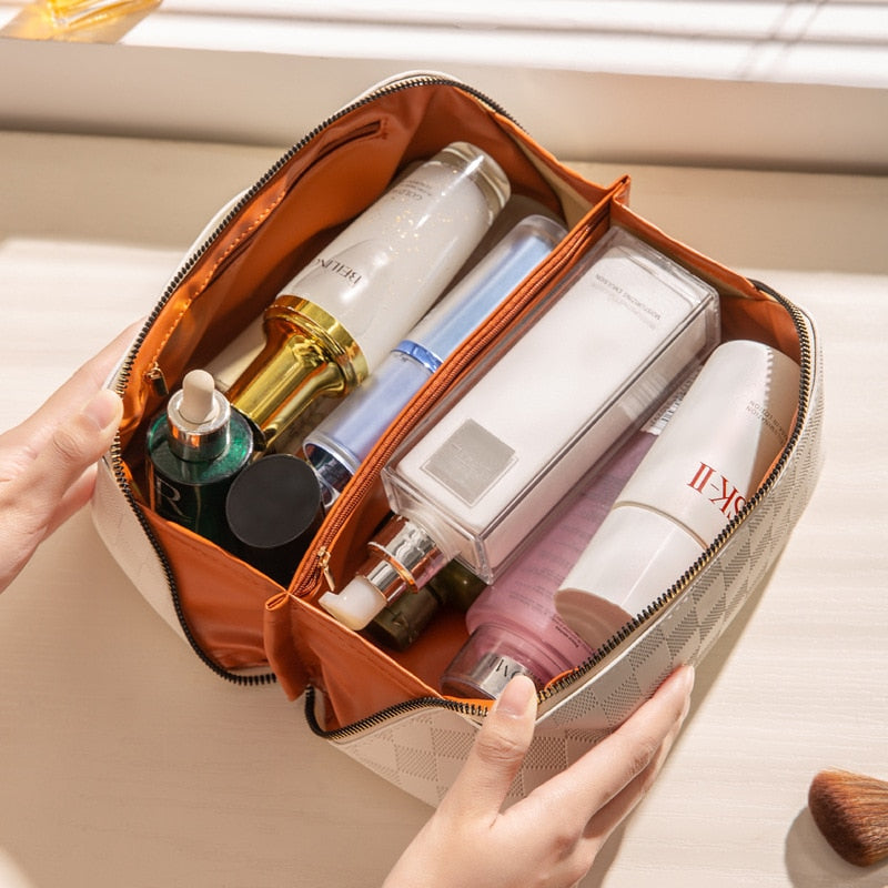 Make-up tas PU-leer oranje met cosmetica open zijkant
