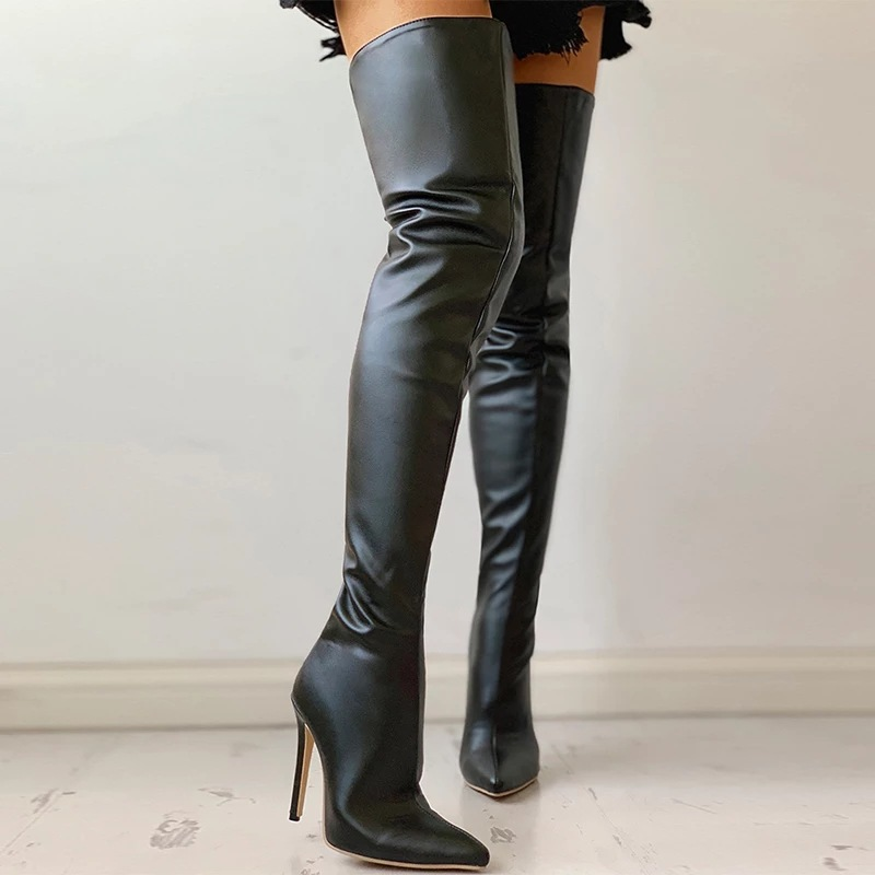 Black over-the-knee boots with gold heel, close-up side view