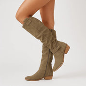 Taupe suede knee-high boots studio shot angled view