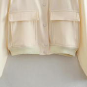 Bomberjack beige met zakken en knopen detail