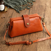 Orange leather crossbody bag side view