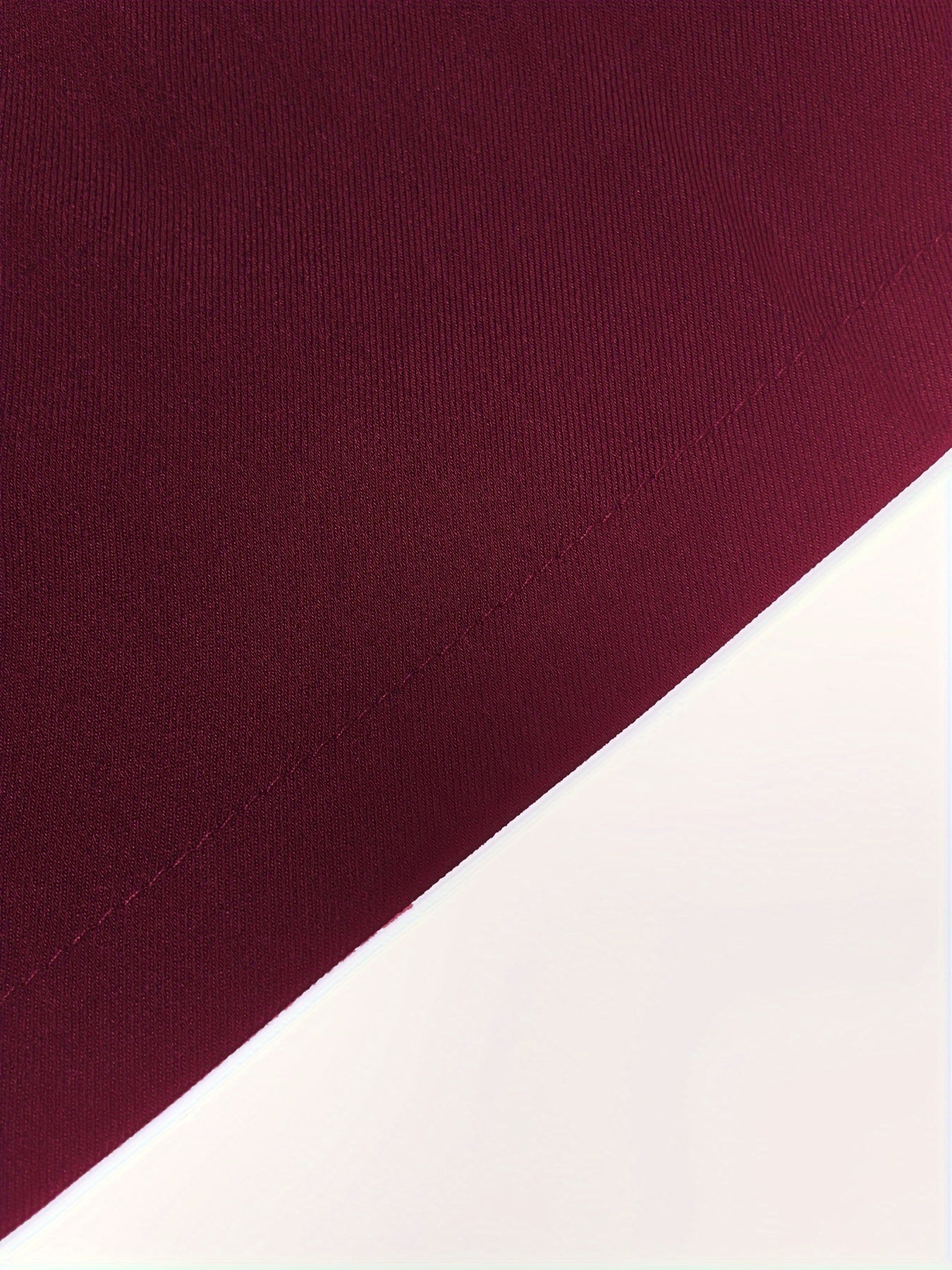 Burgundy sleeveless vest fabric detail