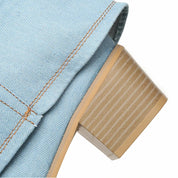 Lichtblauwe denim laarzen met beige hak detail shot