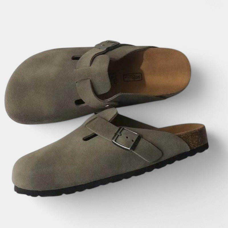Gray suede clogs with black buckle front view
