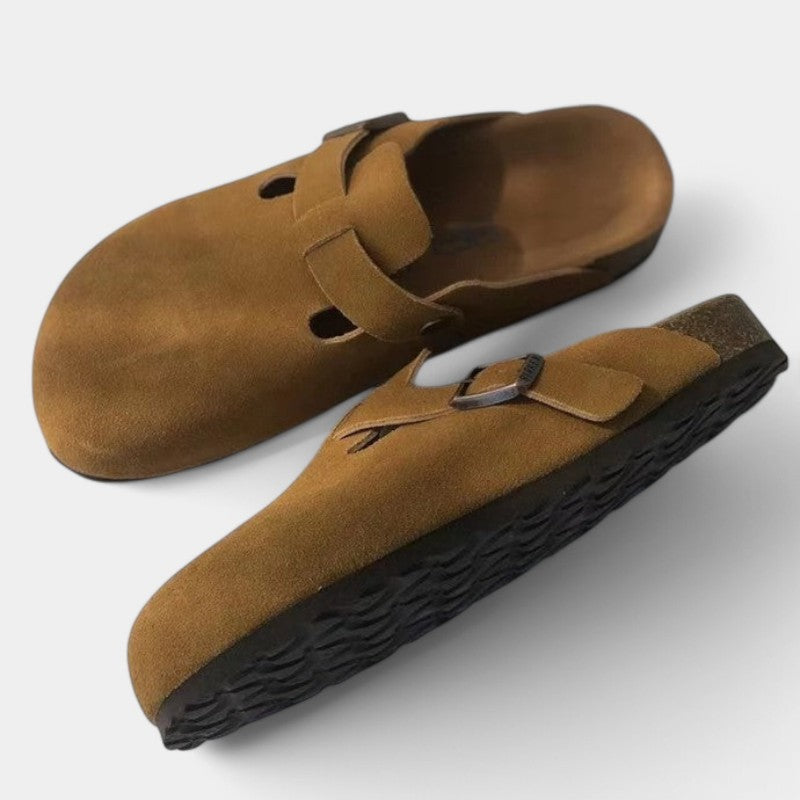 Brown suede clogs with textured sole front view