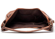 Brown leather hobo bag interior view with zipper pocket