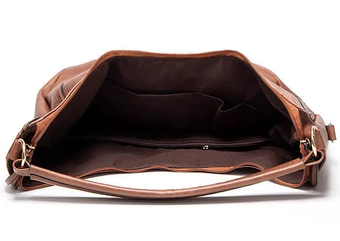 Brown leather hobo bag interior view with zipper pocket