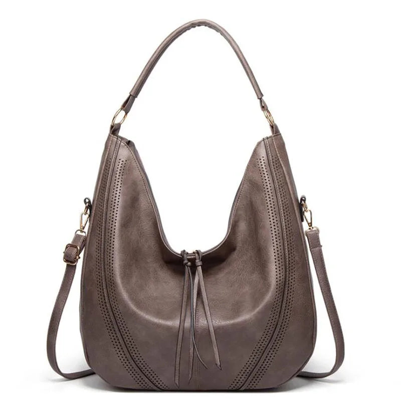 Gray leather hobo bag front view with perforated details