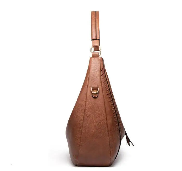 Brown leather hobo bag back view with perforated details