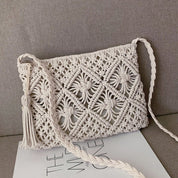 White macramé crossbody bag on couch