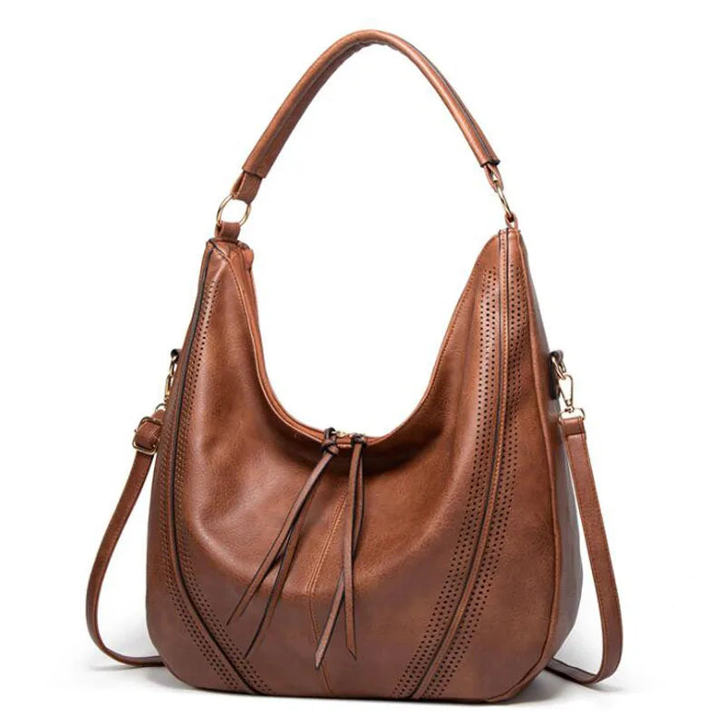 Brown leather hobo bag front view with perforated details