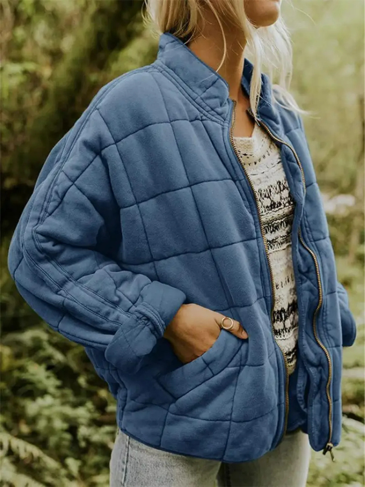 Blue quilted bomber jacket front view