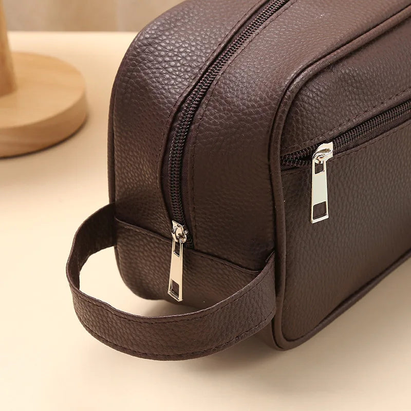 Brown toiletry bag close-up of zipper detail