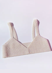 Pearl bralette white flat lay showcasing intricate design