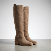 Taupe suede knee-high boots studio shot front view on stand