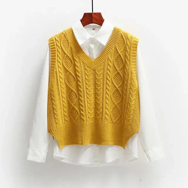 Yellow knitted vest with cable pattern over white shirt front view