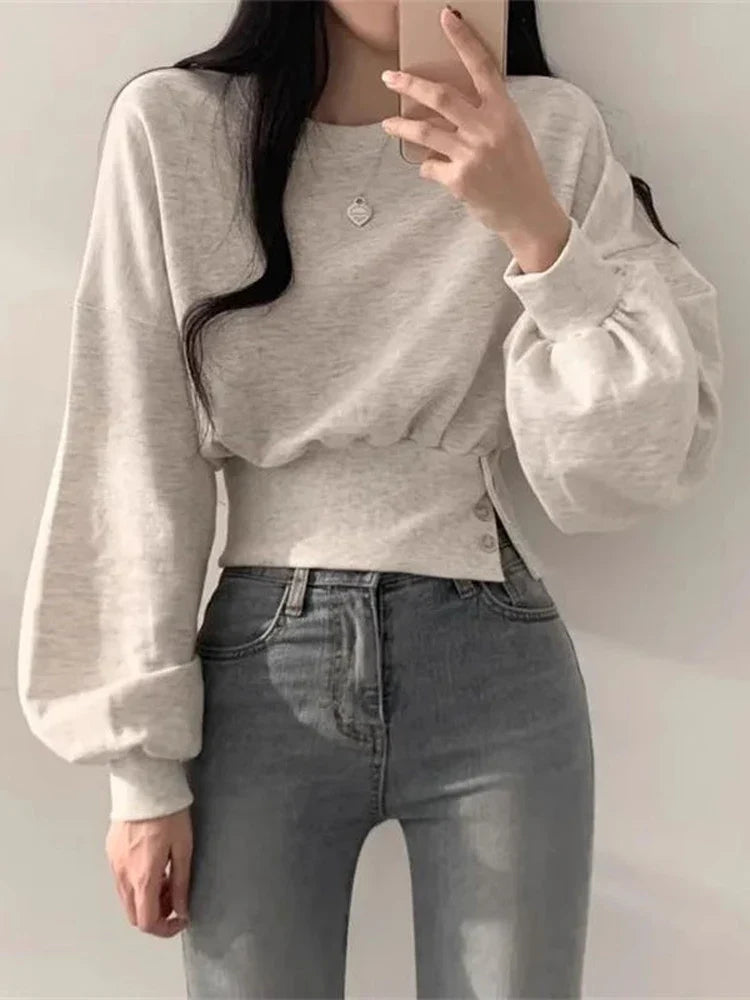 Grijze hoodie met lange mouwen en knoopdetails, front view
