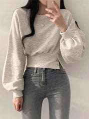 Grijze hoodie met lange mouwen en knoopdetails, front view
