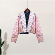 Tweezijdige damesjas met bloemenprint en blauwe randen, hangend