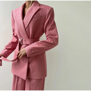 Pink herringbone blazer with belt detail close-up