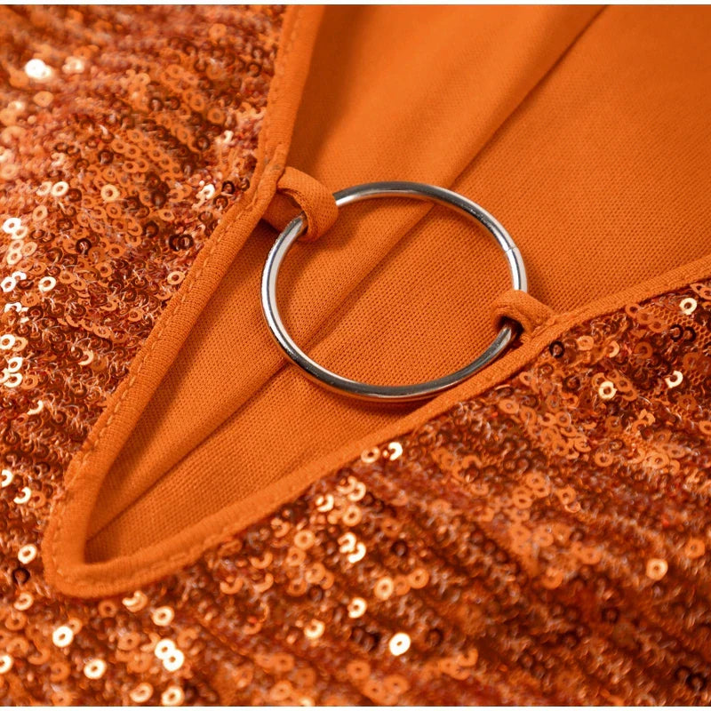 Mini jurk oranje met glitter en ringdetail close-up