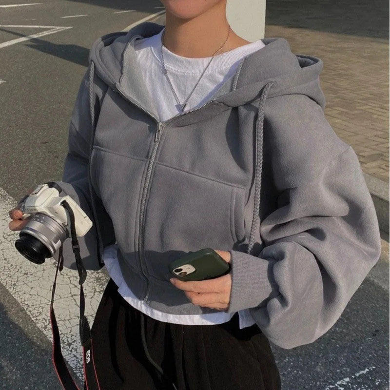 Grijze hoodie met rits en zakken, zijkant weergave