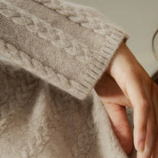 Trui met kabelpatroon beige detailopname
