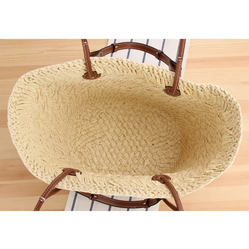 Woven straw tote bag interior view showing spacious beige lining