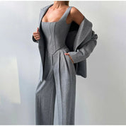 Gray herringbone suit with blazer and wide pants front view