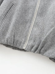 Grijze bomberjas met ritsdetail close-up