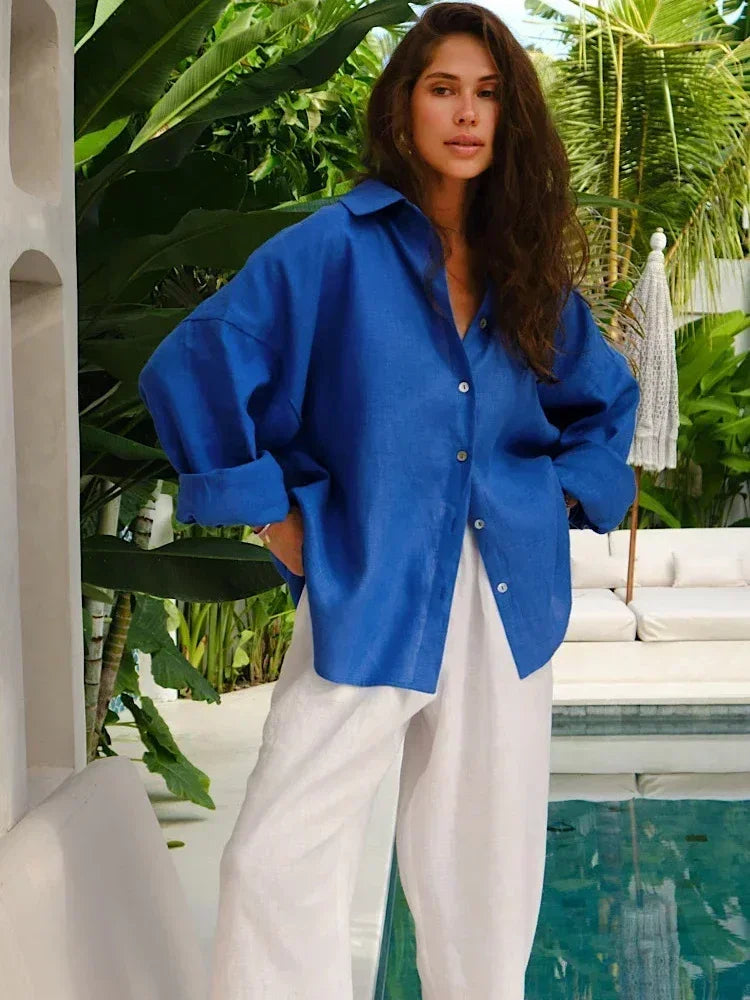 Blue linen blouse with white pants, side profile