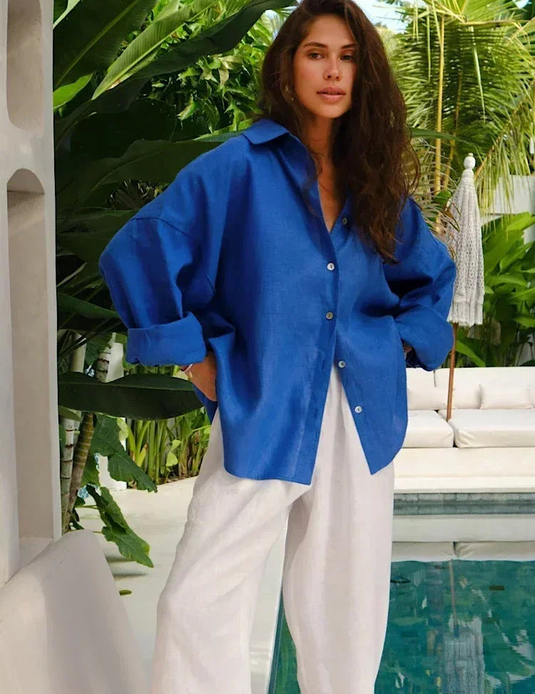 Blue linen blouse with white pants, side profile