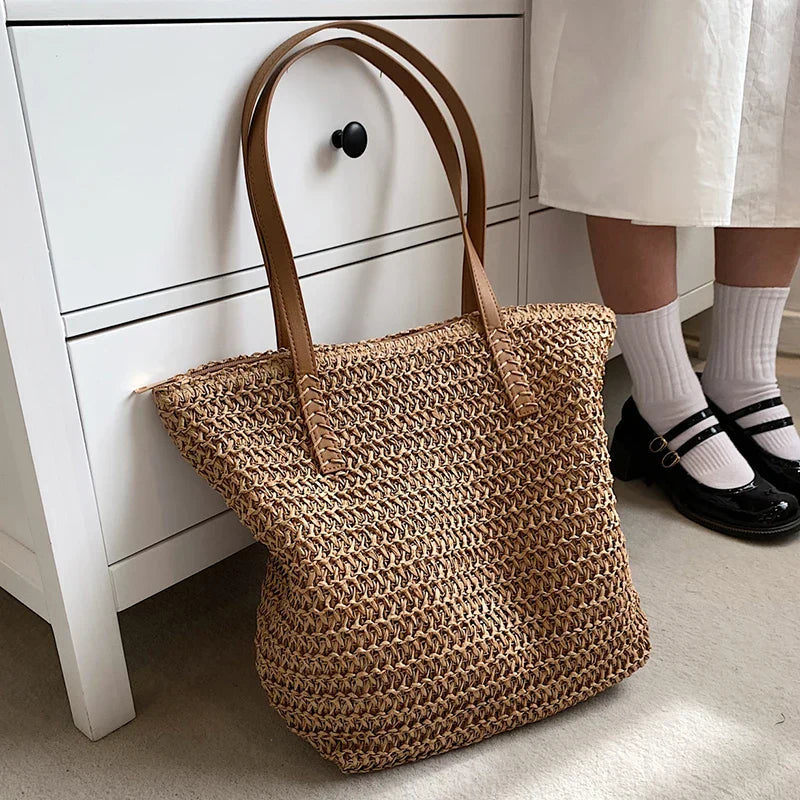 Woven straw tote bag beige side view with person