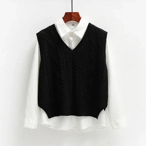 Black knitted vest with cable pattern over white shirt front view
