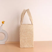 Woven straw tote bag beige front view with handles