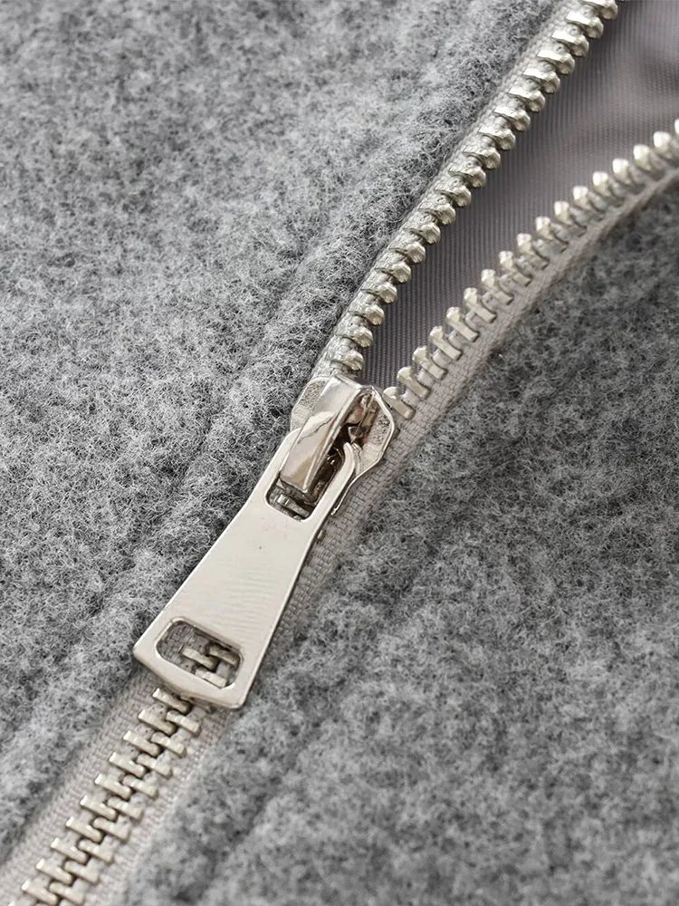 Grijze bomberjas met zilveren rits detail