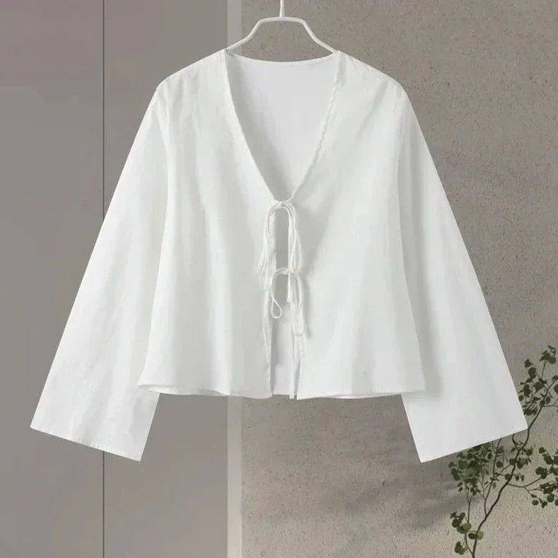 White blouse with tie detail hanging view